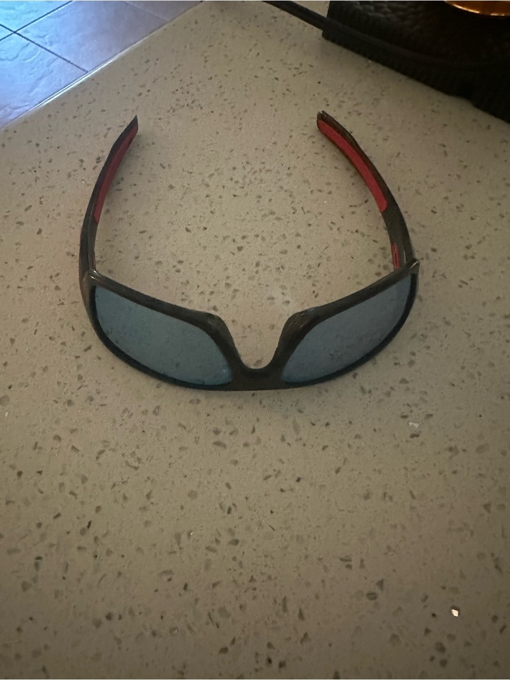 Oakley Polarized Kids Black Frame Sunglasses with Red Temples and Blue Lenses
